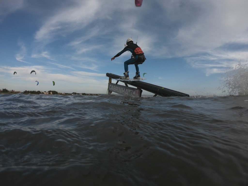 kiteboarder riding a slider in Sicily flatwater Italy features world class kiteboard academy