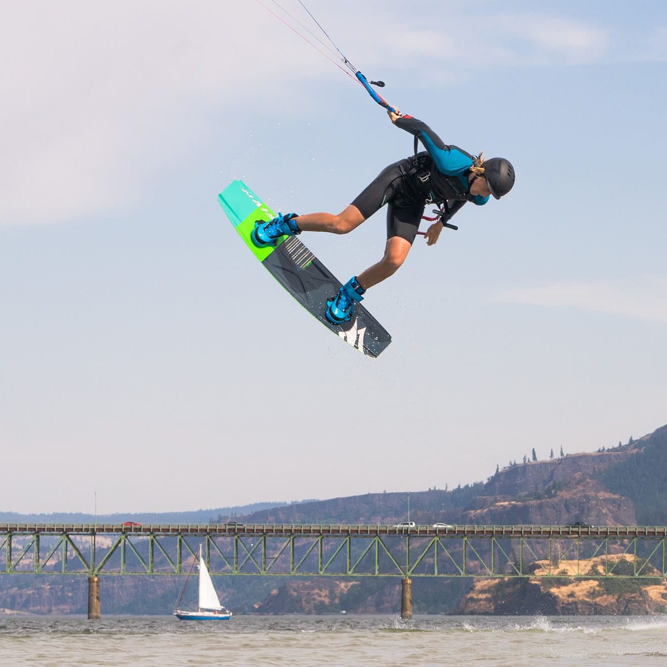 Young Kiteboarder doing a grab at the Hood River Junior Jam