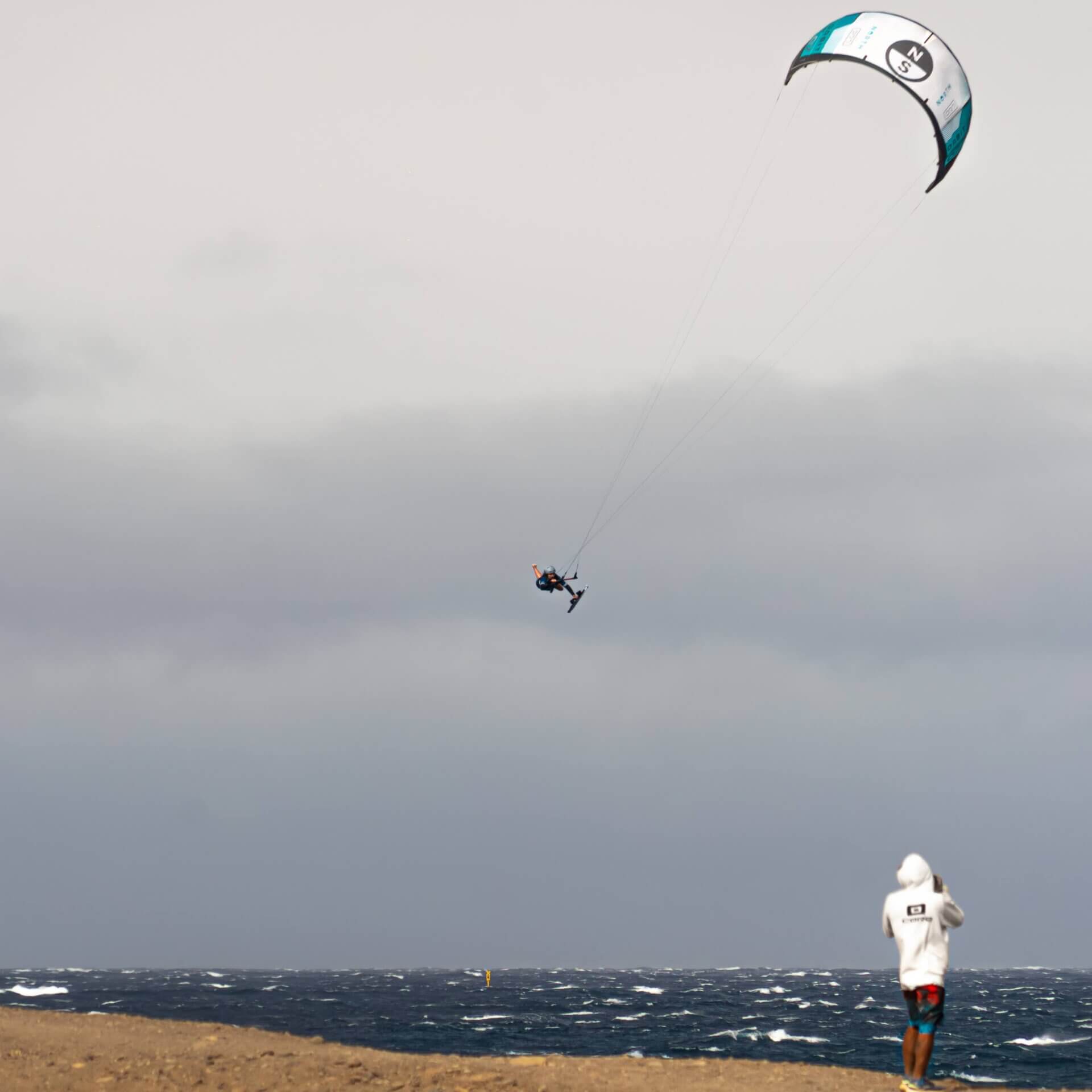 Kiteboarder sending a big air jump over the ocean in the Canary Islands