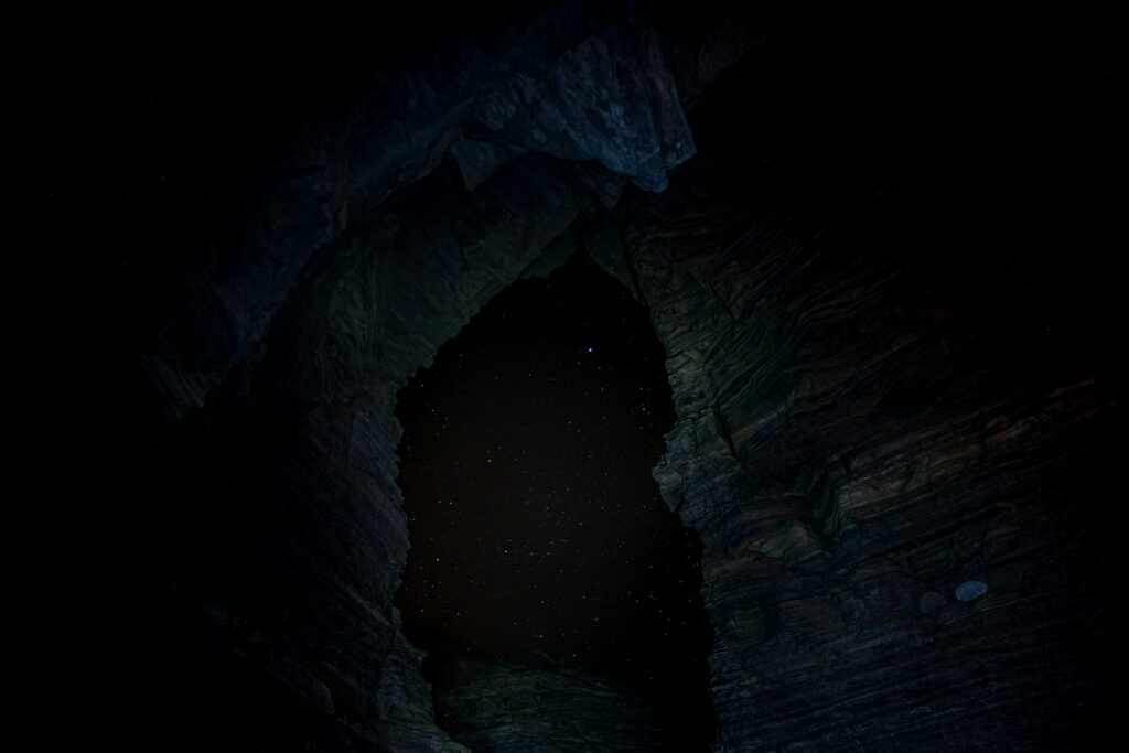 brown cave with light during daytime